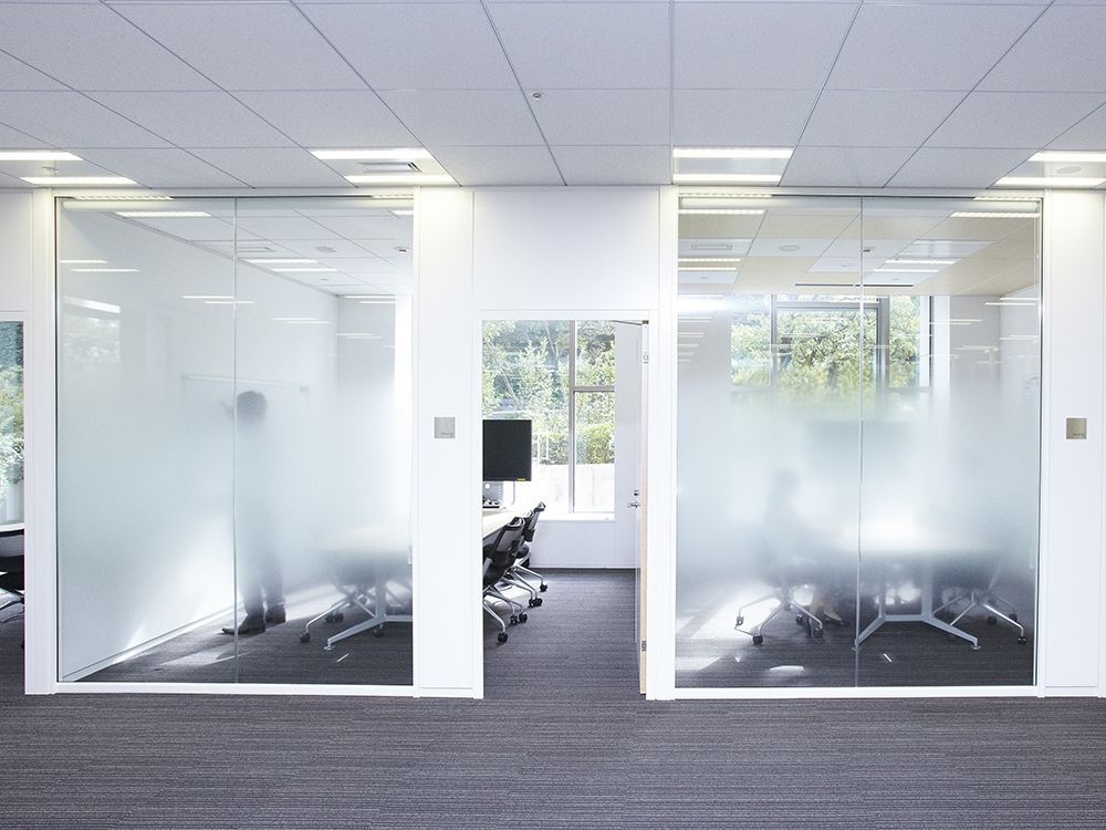 Two conference rooms with foggy windows