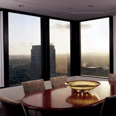 Floor-to-ceiling windows with a view of the city