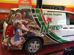 A white van with Norco car wrap