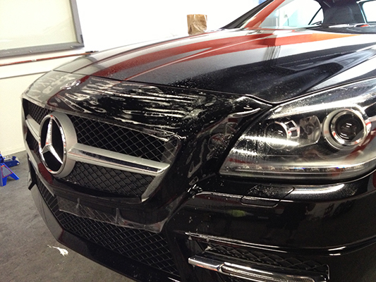 The front of a black Mercedes
